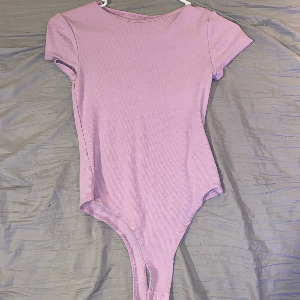 Pink body suit.